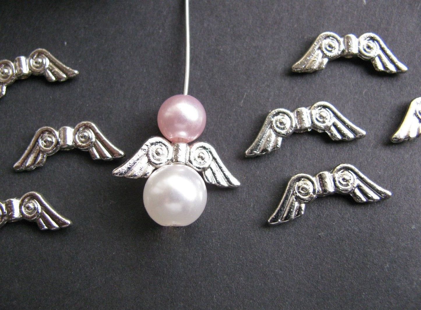 10 Metallperlen Flügel silberfarben 20,5 x 7 mm B-Ware, Engel mit Perlen basteln